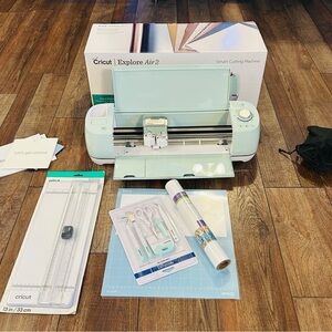 Cricut Explore Air 2 Cutting Machine in Mint Plus additional kit.
